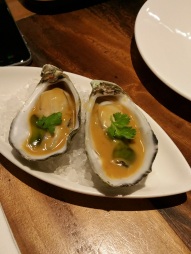 warmed oysters with cream veal jus & herb oil